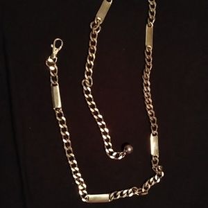 a silver chain belt
